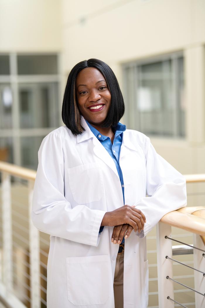 A nursing student looking at the camera for a photo.